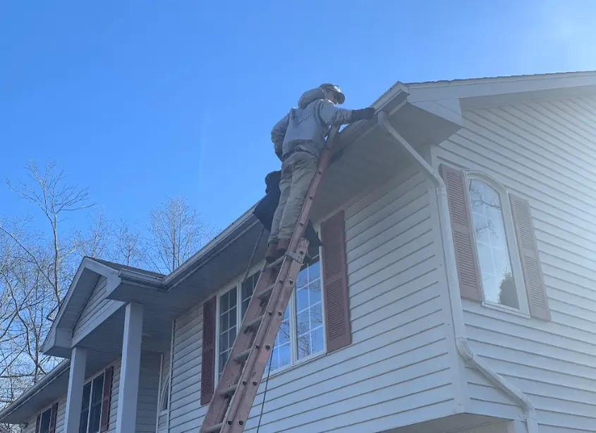 Gutter cleaning and maintenance being performed by North Ridgeville Power Washing in North Ridgeville